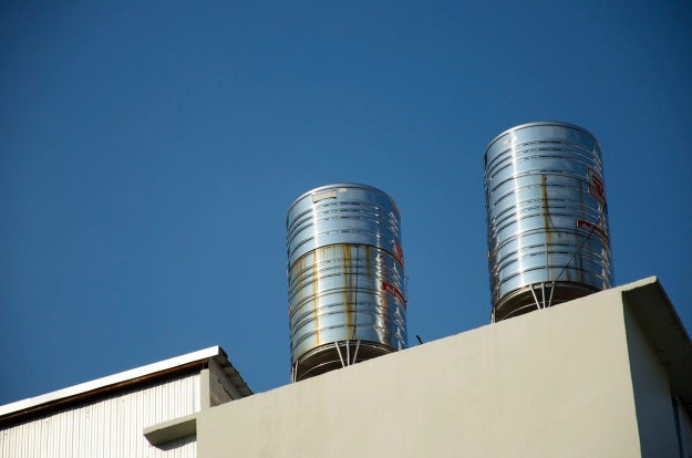 ISO100, 105mm, f/5.6, 1/1000sec Water tanks on building. Bangkok, Thailand